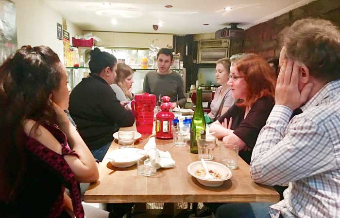 Loutfi Jamal, at the far end of the table, is a chef in a dinner series curated by Nasser Jaber, a Palestinian restaurateur who’s making his mark on New York’s lower east side. — Courtesy photo