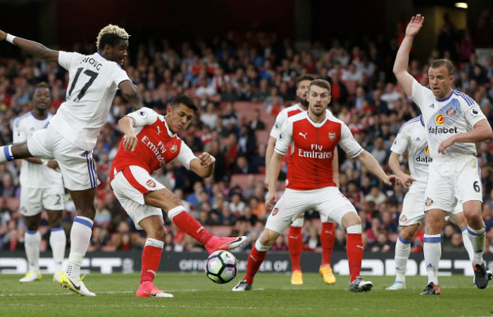 Arsenal’s Alexis Sanchez scores against Sunderland during their Premier League match at the Emirates Stadium Tuesday. — Reuters