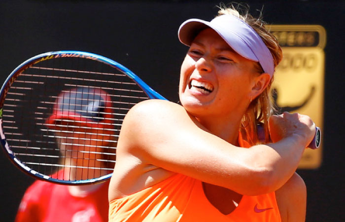 Maria Sharapova of Russia returns the ball during her match against Christina Michael of US in the first round of the Italian Open on Monday. — Reuters