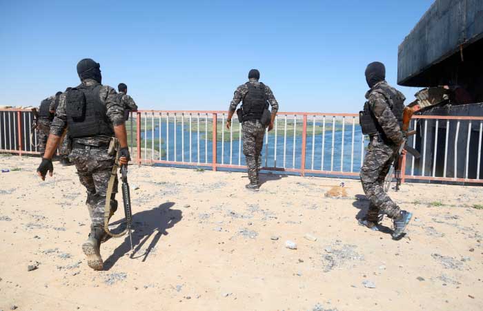 Special forces from the US-backed Syrian Democratic Forces (SDF), made up of an alliance of Arab and Kurdish fighters, inspect the Tabqa dam on Saturday after it had been recaptured earlier this week along with the adjacent city. US-backed fighters said they were preparing for a final assault on the Daesh group's Syrian bastion Raqa, likely next month, with new weapons and armored vehicles promised by Washington. — AFP