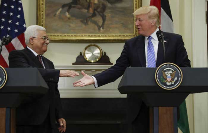 President Donald Trump reaches to shakes hands with Palestinian leader Mahmoud Abbas after speaking in the Roosevelt Room of the White House in Washington, Wednesday, May 3, 2017. — AP