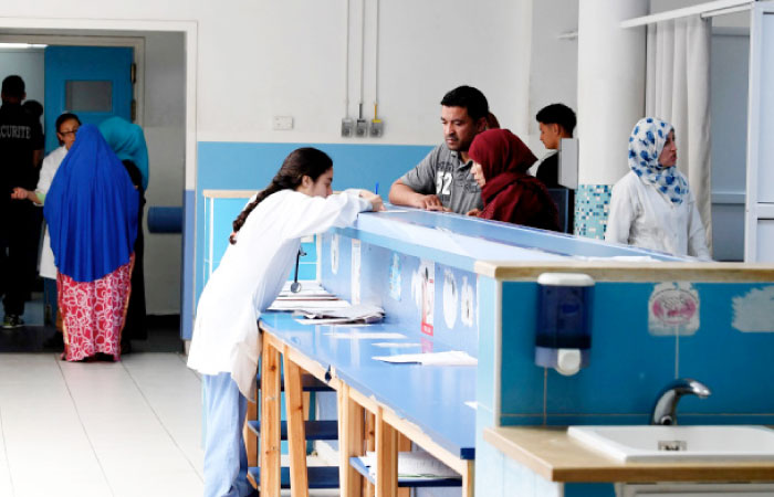 Tunisian patients arrive at the emergency room of the Charles Nicole Hospital in Tunis. — AFP