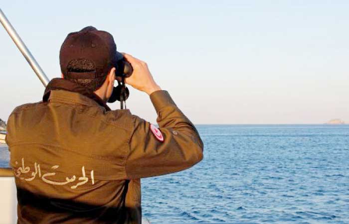 A member of the Tunisian coast guard inspects the maritime borders in the region off Tunisia’s northern town of Bizerte during a 24-hour patrol of the area. — AFP