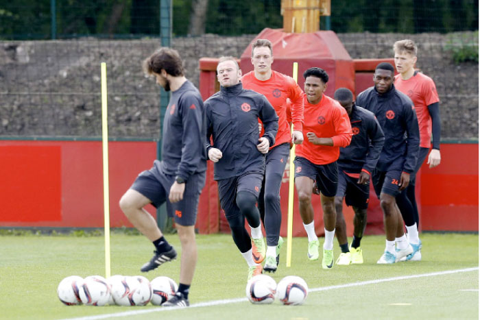 Manchester United's Wayne Rooney, second left, attends a training session at the AON Training Complex in Carrington, England, Tuesday, ahead of the Europa League Final against Ajax on Wednesday. — AP