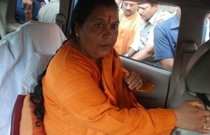 Indian Bharatiya Janshakti Party (BJP) leader Uma Bharti leaves after a court hearing in in Lucknow on May 30, 2017.  — AFP