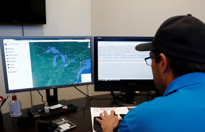 An operator demonstrates the software used in the BlackBerry fleet-tracking service known as Radar, which uses $400 boxes to collect and transmit information on movement, temperature and physical contents of truck trailers, at the Titanium Transportation trucking firm in Bolton, Ontario, Canada. — Reuters