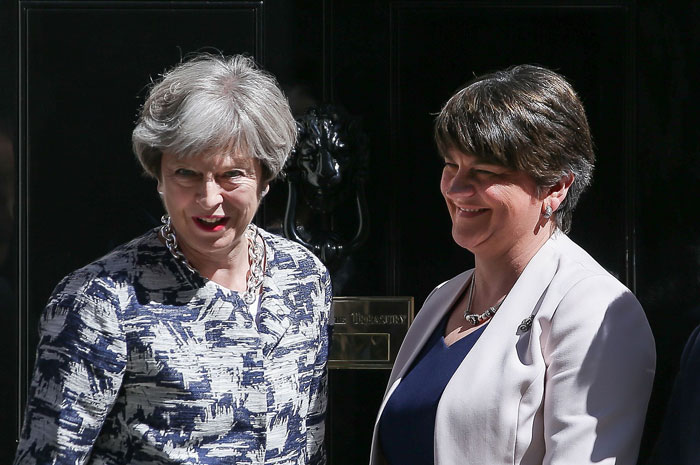 Britain's Prime Minister Theresa May (L) poses for a picture with Democratic Unionist Party (DUP) leader Arlene Foster at 10 Downing Street in central London on Monday. — AFP