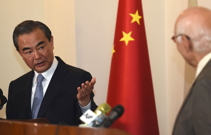 Visiting Chinese Foreign Minister Wang Yi, left, gestures to Pakistan's adviser on foreign affairs Sartaj Aziz during a press conference, in Rawalpindi, Pakistan, Sunday. — AP