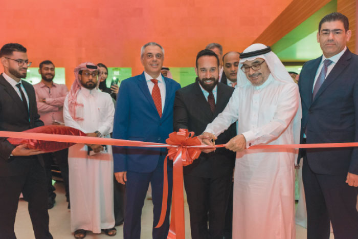 Sheikh Mohamed Yousuf Naghi, Chairman of Mohamed Yousuf Naghi & Brothers Group, cuts the ceremonial ribbon, alongside Stavros Paraskevaides, Managing Director of Mohamed Yousuf Naghi Motors and Mohammad Fawzi, Head of Sales Channel Development, Middle East and Africa, Rolls-Royce Motor Cars