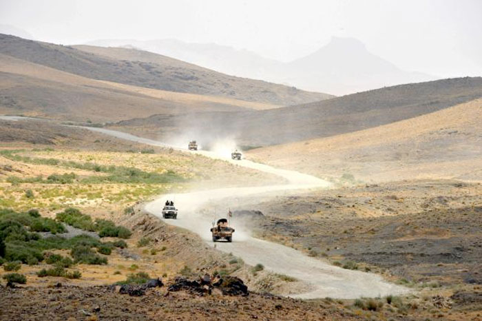Afghan National Army (ANA) soldiers patrol the Shah Wali Kot district of Kandahar province. — AFP