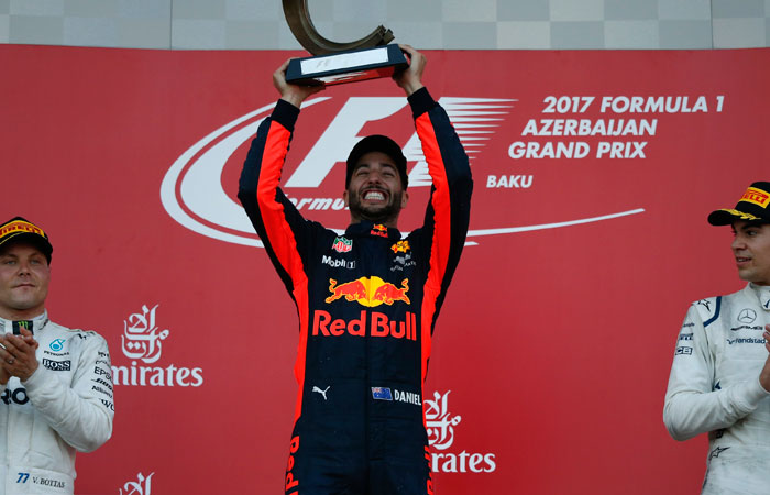 Red Bull Racing Formula One driver Daniel Ricciardo (C) of Australia celebrates his victory over second placed Mercedes' Valtteri Bottas (L) and third placed Williams' Lance Stroll at the Azerbaijan Grand Prix in Baku Sunday. — Reuters