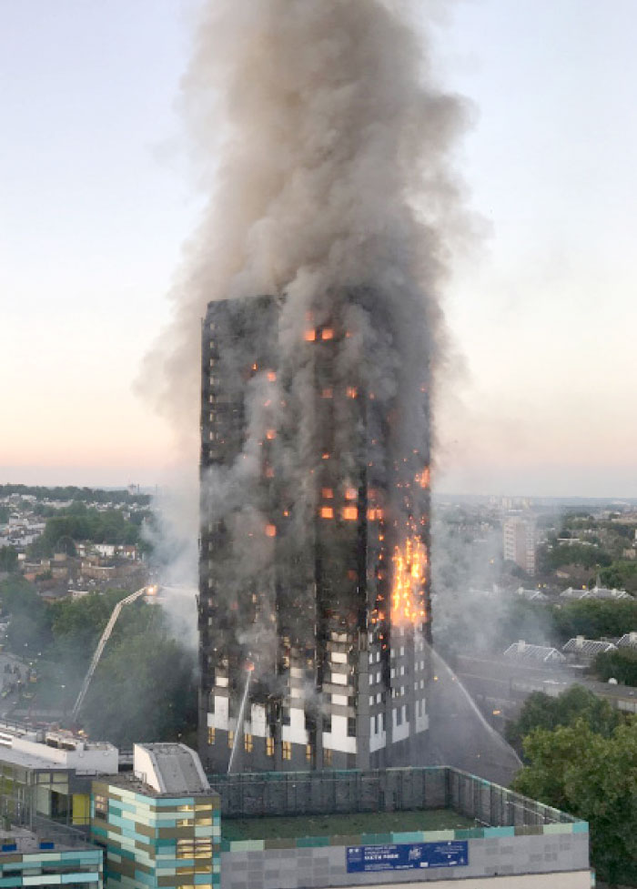 This handout image received by local resident Natalie Oxford early on Wednesday shows flames and smoke coming from a 27-storey block of flats after a fire broke out in west London. The fire brigade said 40 fire engines and 200 firefighters had been called to the blaze in Grenfell Tower, which has 120 flats. — AFP