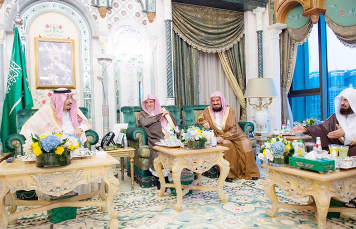 Custodian of the Two Holy Mosques King Salman with imams of the Grand Mosque in Makkah, Thursday evening. — SPA