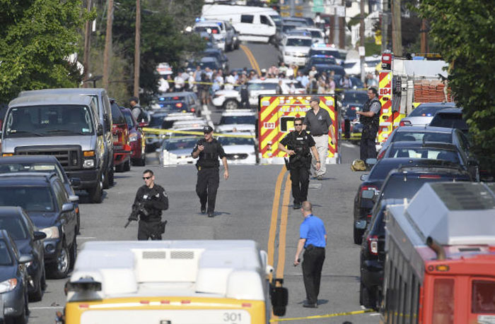 Emergency personnel respond after reports of shots fired on Wednesday. — AP