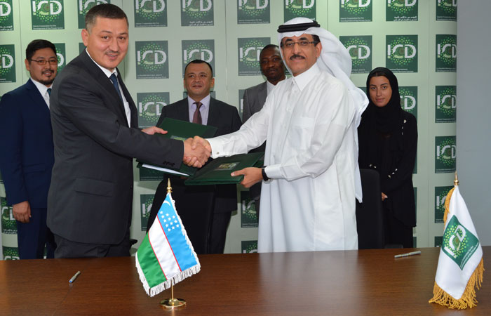 ICD CEO Khaled Al-Aboodi, right, exchanges the Line of Financing facility agreement with Shukhrat Rasulov, the acting chairman of the management board of JSCB ‘Microkreditbank’, in Jeddah. — Courtesy photo