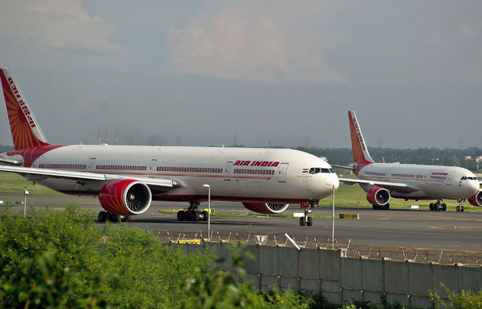 This file photo shows Air India planes preparing for takeoff at Indira Gandhi International Airport in New Delhi. Indian Finance Minister Arun Jaitley approved a plan on Wednesday to sell the government's stake in the Air India airline. — AFP