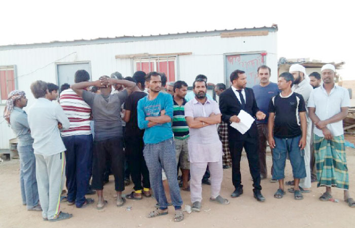 Some of the expatriate workers allegedly abandoned by their employer in a desert area, 310 kilometers away from Hail. — Courtesy photo