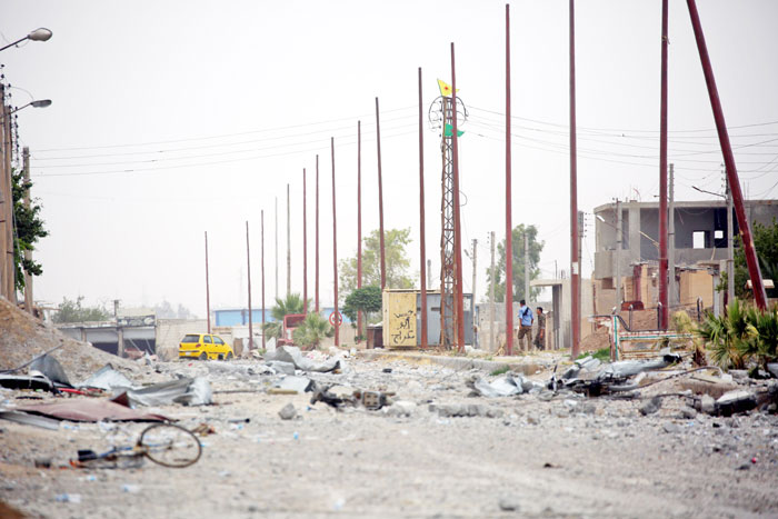 A damaged street in the Daesh group’s Syrian bastion of Raqqa after the neighborhood was seized by the Syrian Democratic Forces (SDF), made up of an alliance of Kurdish and Arab fighters. — AFP