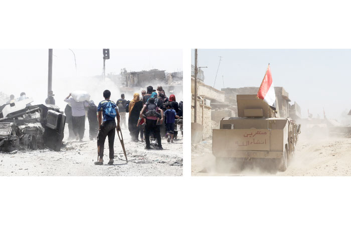 A young Iraqi walks on crutches while fleeing from the Old City of Mosul while Iraqi forces advance on Wednesday, during the ongoing offensive by Iraqi forces to retake the last district still held by Daesh (the so-called IS) group. (Left) Iraqi forces’ humvees advance toward Mosul, late Tuesday. — AFP photos