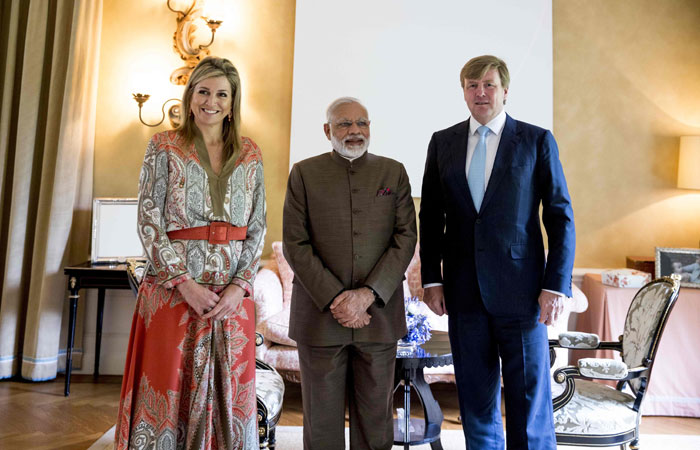 Queen Maxima (L) and King Willem Alexander (R) of the Netherlands pose for a photograph with Indian Prime Minister Narendra Modi at Villa Eikenhorst in Wassenaar, The Netherlands on Tuesday. — AFP