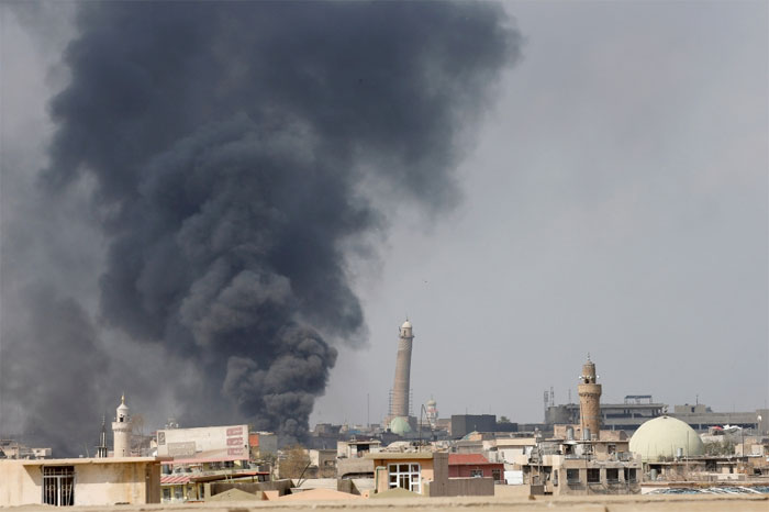 Smoke rises from clashes near Mosul's Al-Habda minaret at the Grand Mosque, where Daesh (the so-called IS) leader Abu Bakr Al-Baghdadi declared his caliphate back in 2014, as Iraqi forces battle to drive out militants from the western part of Mosul in this photo taken in March. — Reuters