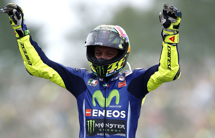 Italy's Valentino Rossi celebrates after winning the Assen Motorcycling Grand Prix at the TT circuit in Assenon, Netherlands, Sunday. —AFP