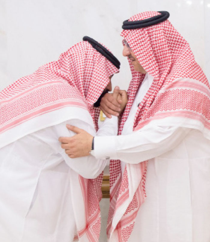 Crown Prince Muhammad Bin Salman, deputy premier and minister of defense, kisses the hand of Prince Muhammad Bin Naif who was among the first to pledge allegiance to the new crown prince in Makkah on Wednesday. — SPA