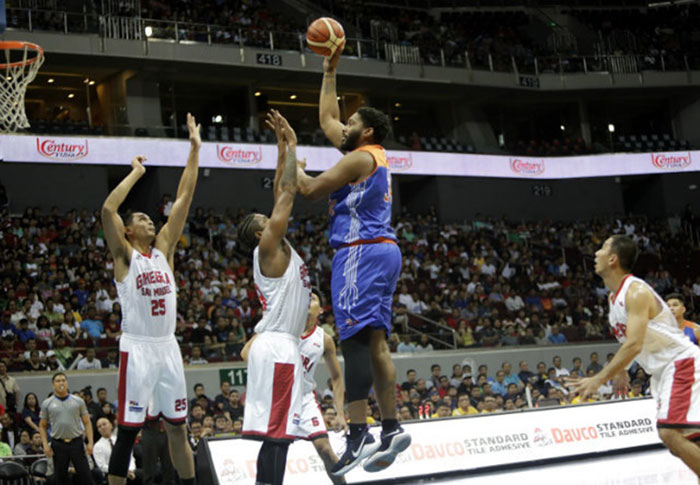 TNT's Josh Smith soars above Barangay Ginebra's Joe Devance and Japeth Aguilar (25) in Game 1 of their 2017 PBA Commissioner's Cup best-of-5 semifinal series at the Mall of Asia Arena Sunday night.