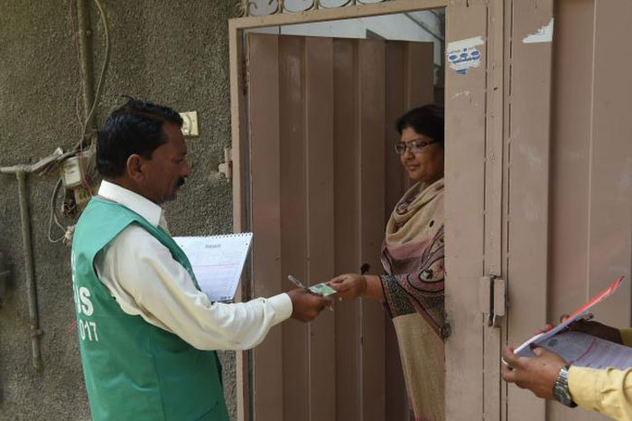 An official of the Pakistan Bureau of Statistics collects information from a Christian woman during a census in the congested neighborhood of Youhanabad in Lahore in this March 28, 2017 file photo. — AFP