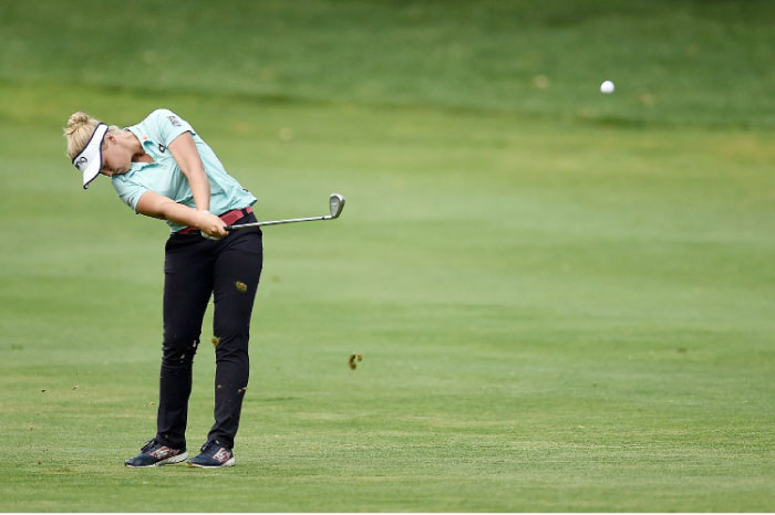 Brooke Henderson of Canada hits her approach shot on the 10th hole during the first round of the Meijer LPGA Classic at Blythefield Country Club in Grand Rapids, Michigan, Thursday. — AFP