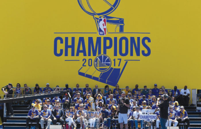 Stephen Curry of the Golden State Warriors talks to the fans at The Henry J. Kaiser Convention Center during their victory parade in Oakland Thursday. — AFP