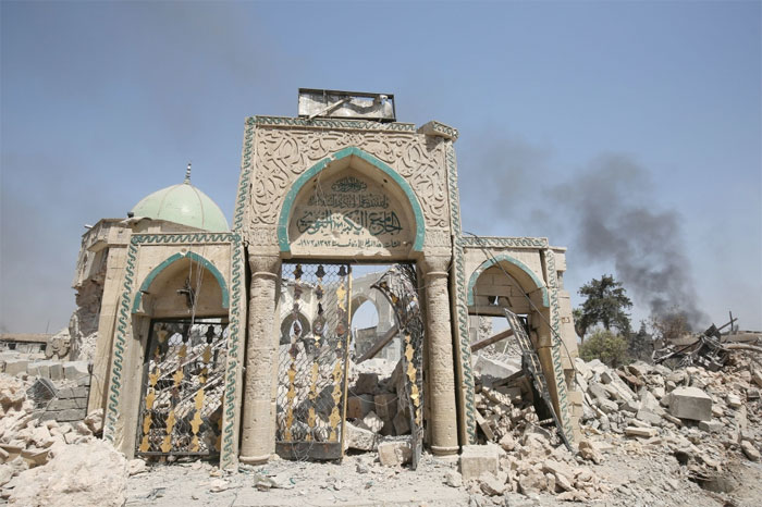 The destroyed gate of the Al-Nuri Mosque in the Old City of Mosul on Friday as Iraqi government forces continue their offensive to retake the city from militants. Daesh (the so-called IS) blew up the mosque and the famed Al-Hadba (hunchback) leaning minaret on June 21 as Iraqi forces closed in. — AFP