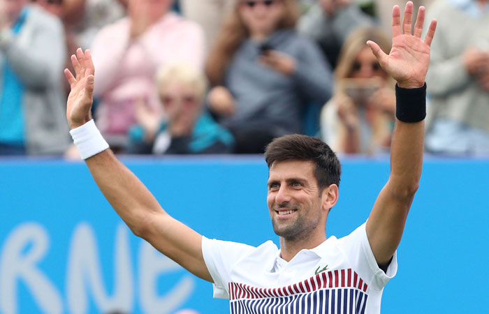 Serbia's Novak Djokovic celebrates his victory over Donald Young of the US at the Aegon International Tennis Tournament at Devonshire Park, Eastbourne, Thursday. — AP