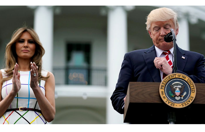 US President Donald Trump delivers remarks as he hosts a Congressional picnic event, accompanied by First Lady Melania Trump at the White House in Washington. — Reuters