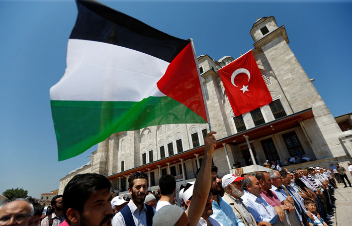 Demonstrators take part in a protest marking the annual Al-Quds Day, or Jerusalem Day, at the courtyard of Fatih mosque in Istanbul, on Friday.