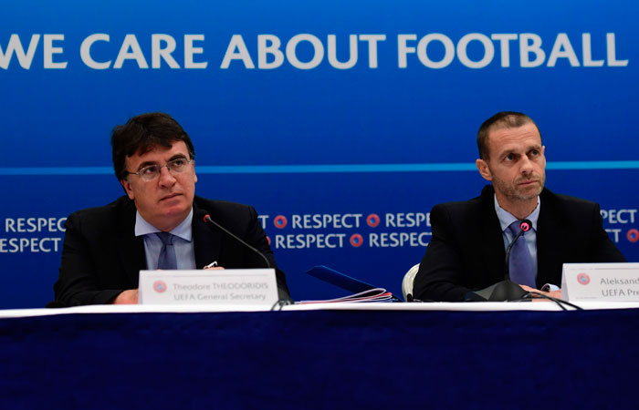 File photo shows UEFA General Secretary Theodore Theodoridis (L) and UEFA President Aleksander Ceferin (R) attend a press conference following a meeting of the UEFA Executive Committee in Cardiff, south Wales recently. — AFP