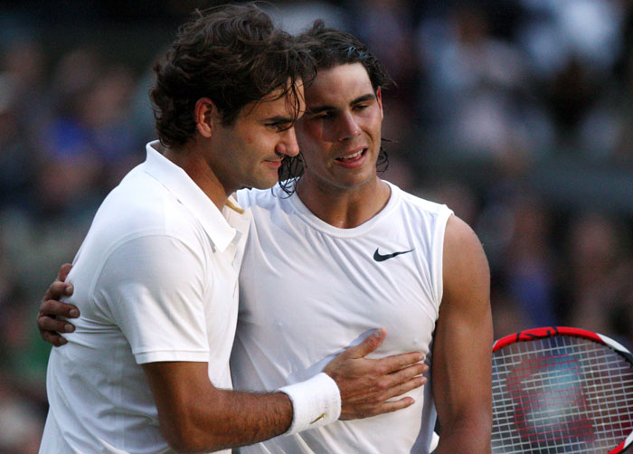 Rafael Nadal of Spain (R) is embraced by Roger Federer of Switzerland after defeating him in the final at the Wimbledon Tennis Championships in London, July 6, 2008. — Reuters