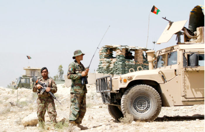 Afghan National Army (ANA) keep watch at a check post in Chaparhar district of Nangarhar province, Afghanistan, in this  May 24, 2017 file photo. — Reuters