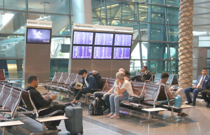 Passengers wait at the Hamad International Airport in the Qatari capital Doha. — AFP