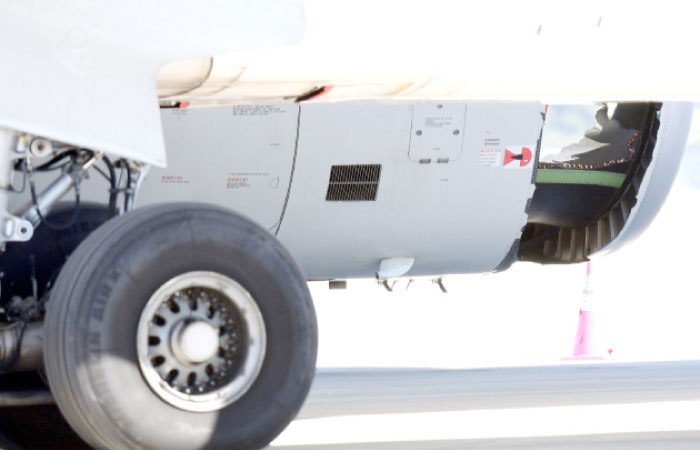 The damaged engine of a China Eastern Airlines Airbus A330 is seen on the tarmac, following an emergency landing, at Sydney International Airport, Australia, on Monday. — Reuters