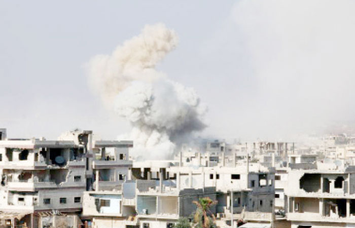 Smoke rises after shelling on a rebel-held area of Deraa, Syria. — Reuters