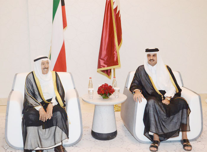 Kuwaiti Emir Sheikh Sabah Al-Ahmad (left), meets with Qatari Emir Sheikh Tamim Bin Hamad in Doha, Wednesday. — AP