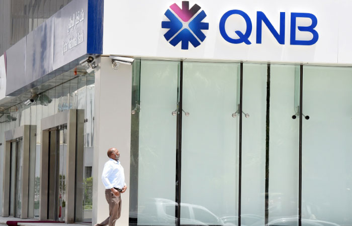 A man walking past the Qatar National Bank (QNB) branch in Riyadh. — AFP