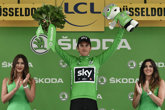 Great Britain's Geraint Thomas celebrates his green jersey of best sprinter on the podium at the end of a 14 km individual time-trial, the first stage of the 104th edition of the Tour de France cycling race in and around Dusseldorf Saturday. — AFP
