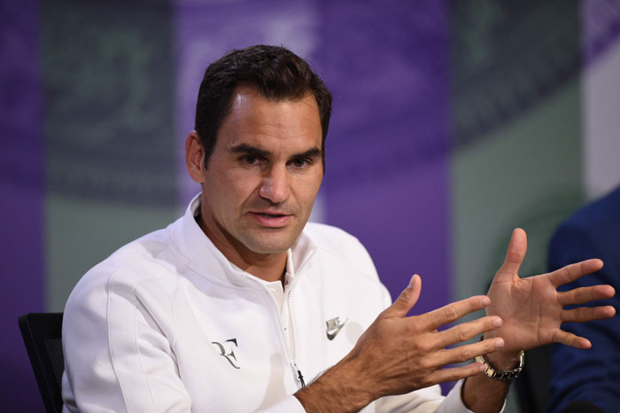 Switzerland's Roger Federer addresses a press conference at Wimbledon Saturday. — AFP